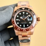 Rolex GMT-Master series, black dial, black and red bezel, 40mm, gold and silver Oyster bracelet.